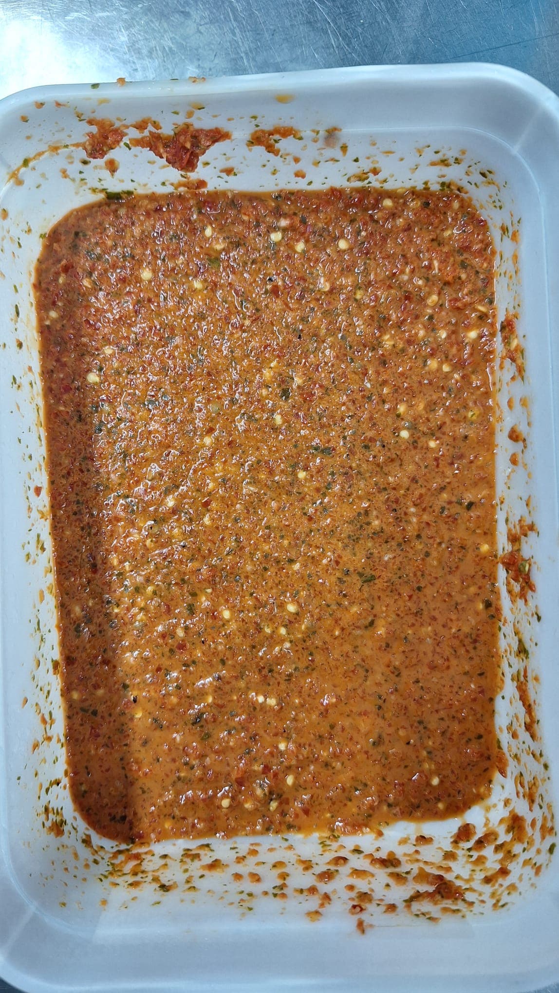 Freshly blended Jungle Sauce, close up on the texture of chilli, garlic and herbs